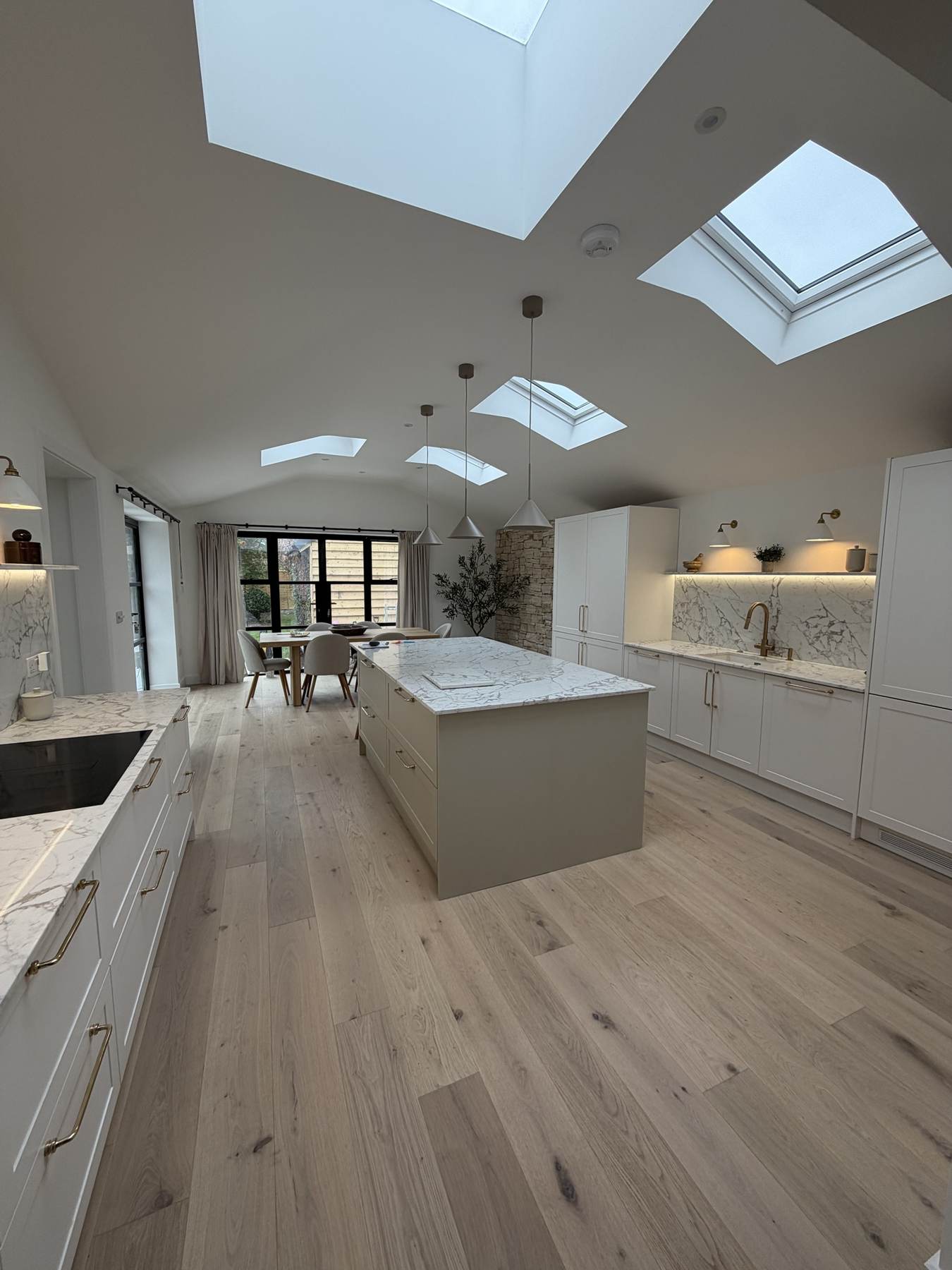 Bright vaulted kitchen with rooflights in a new single-storey extension in Christchurch