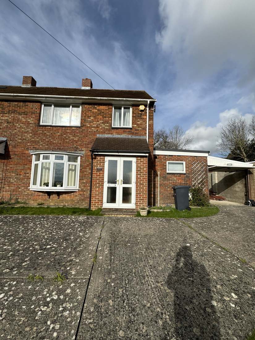 Before: semi-detached house with old concrete drive and flat-roof side garage